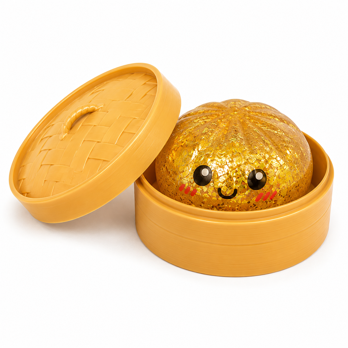 A cute, round, glittery golden character toy with a smiling face peeking out from inside a round yellow container, with its woven-style lid leaning against it on a white background.